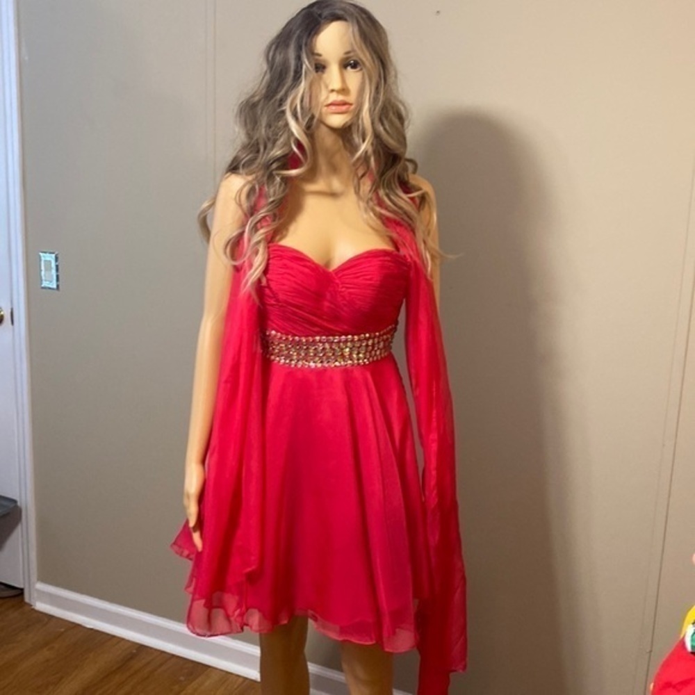 Size 0 blush prom dress worn once. Its a knee length dress  has a sash with it